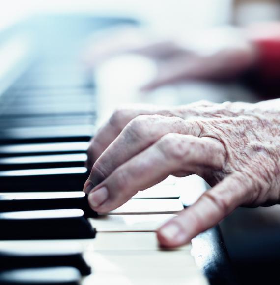 Senior woman playing the piano