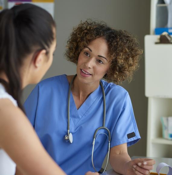 Nurse and patient speaking about cardiovascular disease diagnosis