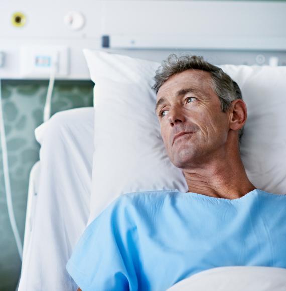 Patient in hospital bed depicting multiple long-term conditions