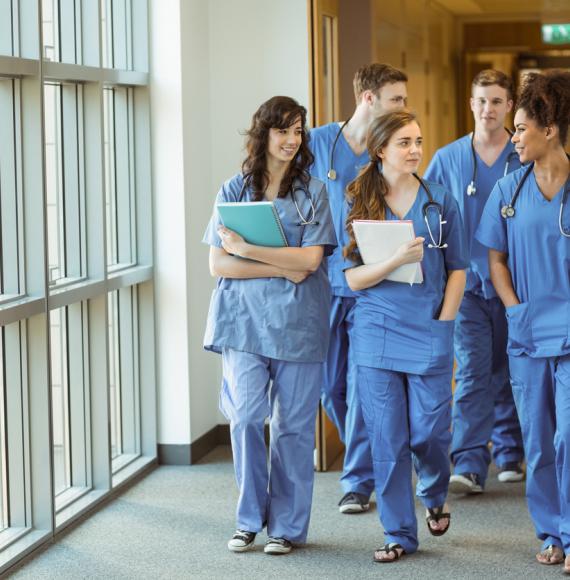 Medical students walking through a hospital