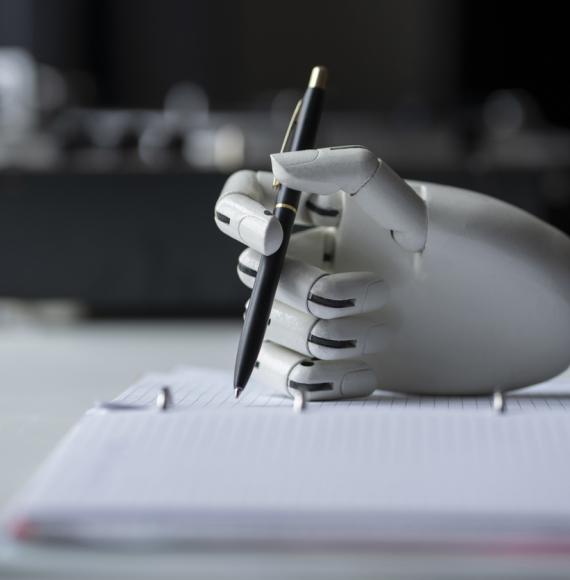 Robot holding a pen depicting AI tools in healthcare peer-reviewing grant applications