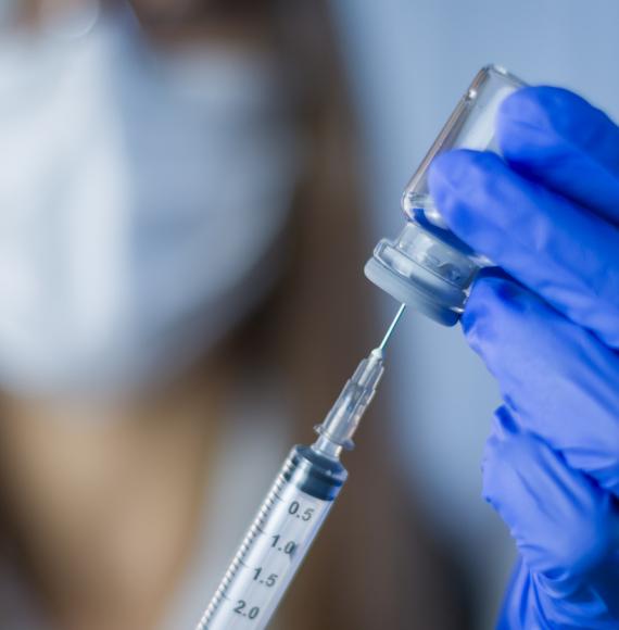 Researcher holding a vaccine