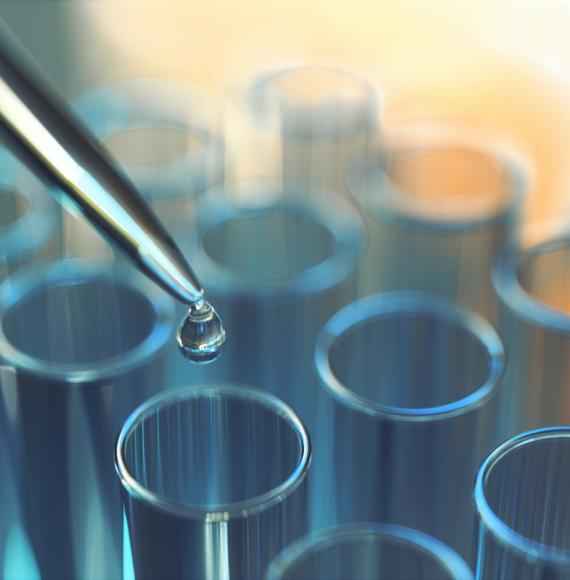 Close-up of beakers in a lab depicting motor neurone disease research