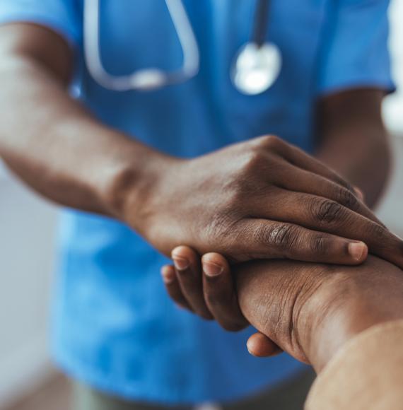 Image of a nursing holding the hand of patient depicting NICE's new guidance for NHS stroke patients