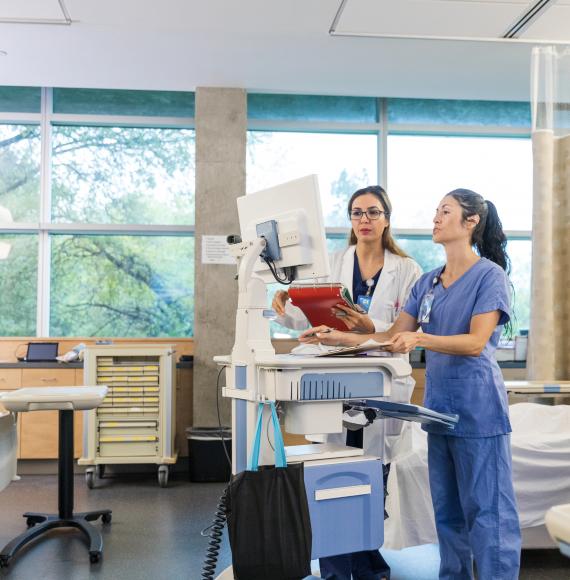 Doctors using a computer to access patient data