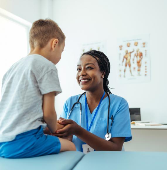 Image of health professional with a child depicting the NHS's new paediatric early warning system