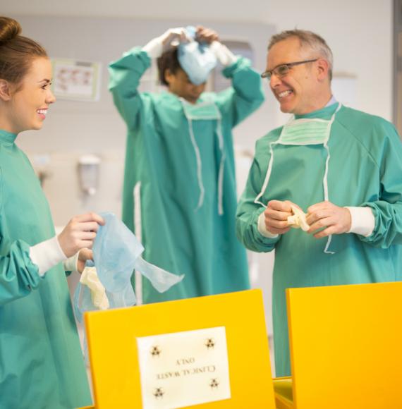 young nurse disposes of clinical waste