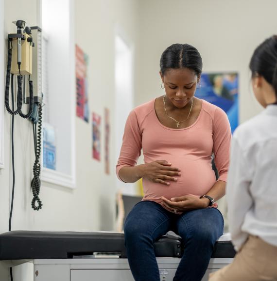 Pregnant mother receiving maternity care