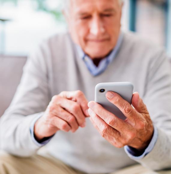 Old man using phone