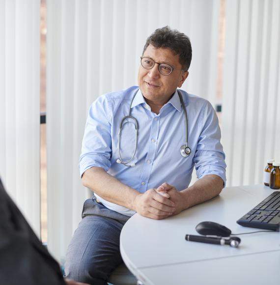 A GP listening to a sales pitch
