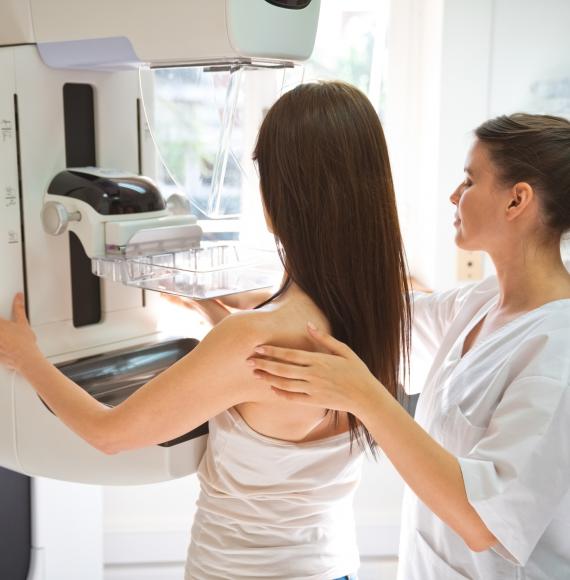 Female doctor and mid adult woman during Mammography test