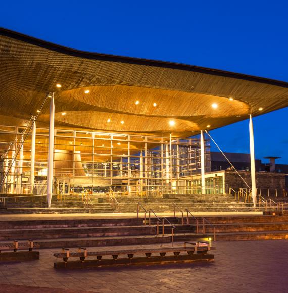 Wide angle view of The Senedd at dusk