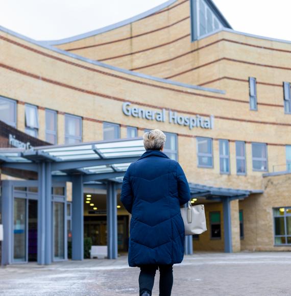 Woman stood outside a hospital