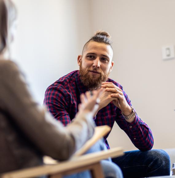 Young man talking to a therapist
