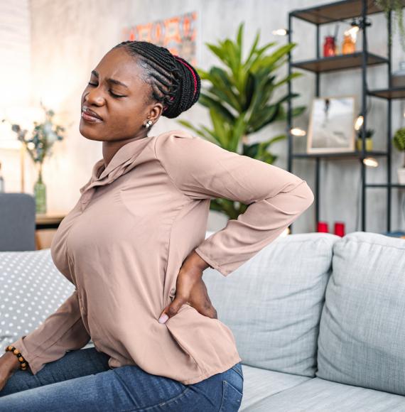 woman suffering with back pain