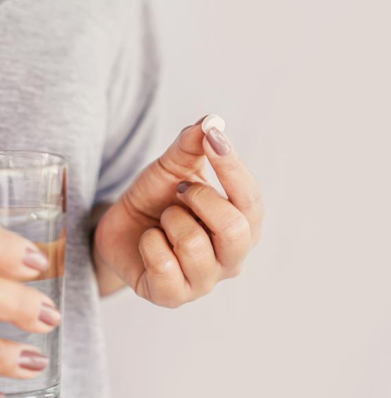 Woman taking a pill
