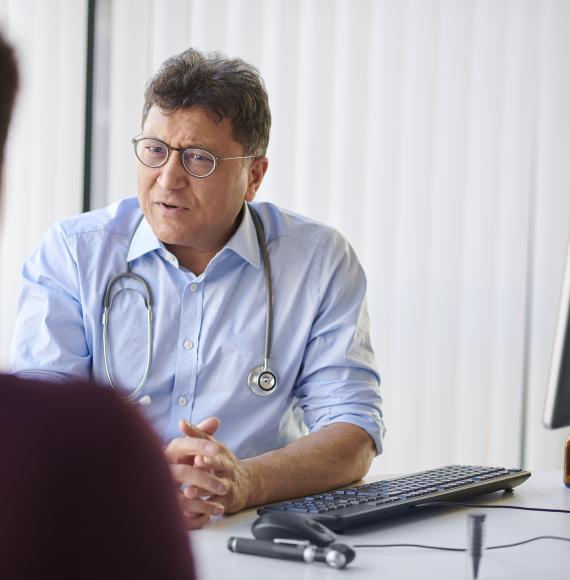 Man speaking to a GP