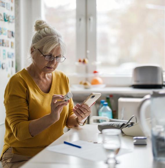 Older woman on medication with mobile phone