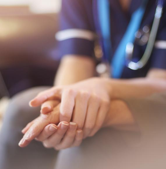 Nurse consoles berieved person