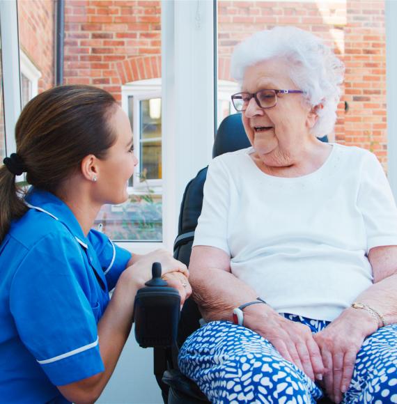 Senior woman talking to a nurse