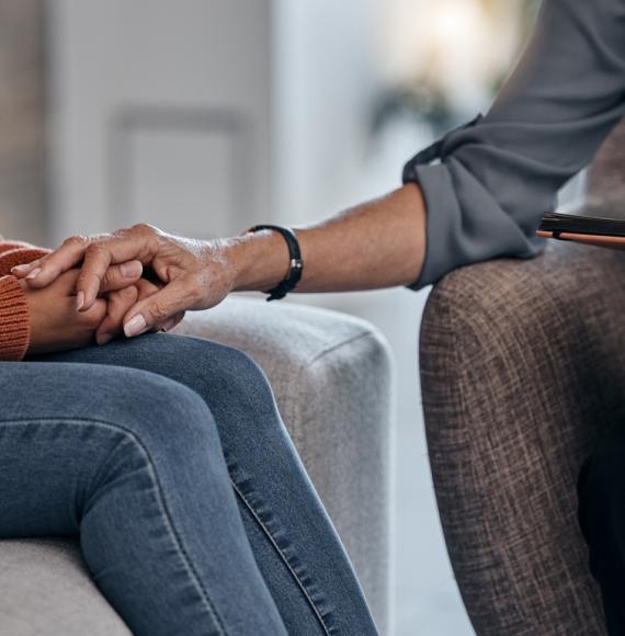 Therapist consoling a patient