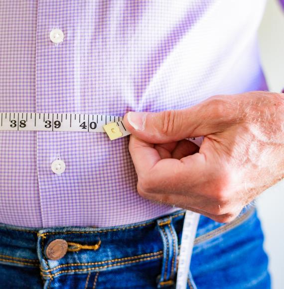 Man measuring his waist