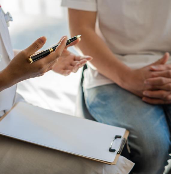 Doctor diagnoses a patient