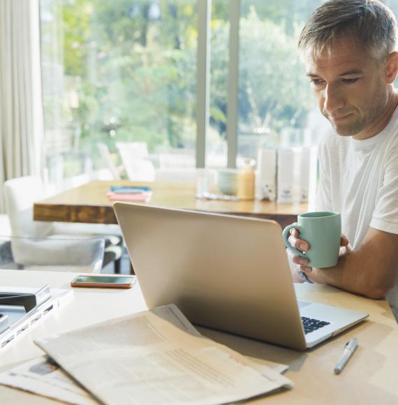 Man using a laptop at home