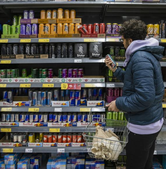 Person buying energy drink
