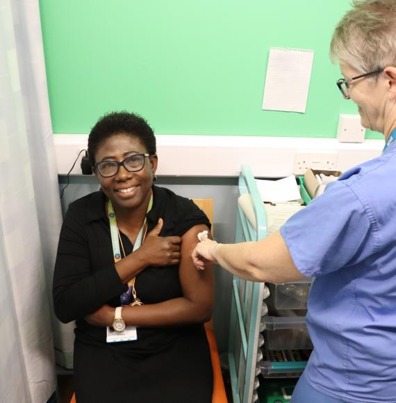 Esther Mireku, public health consultant, having a flu vaccine recently
