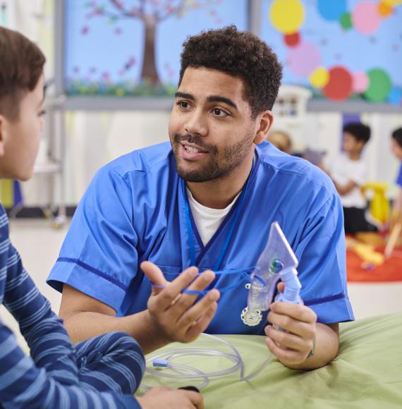 paediatric nurse talking to patient