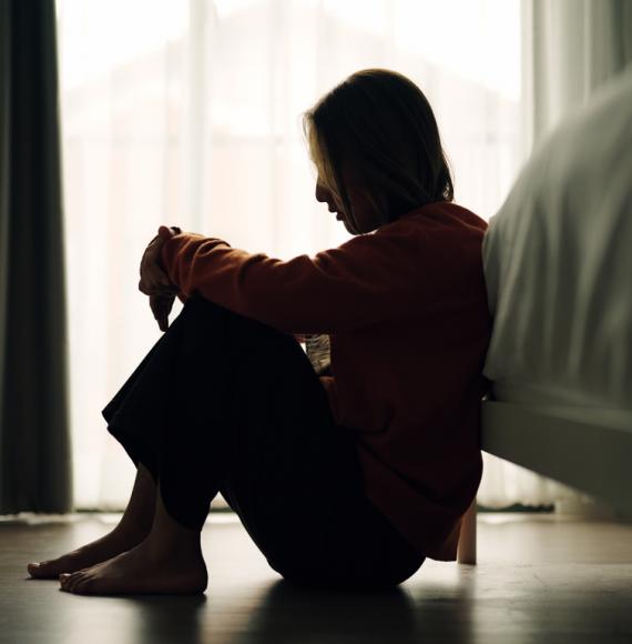 A woman struggling with her mental health