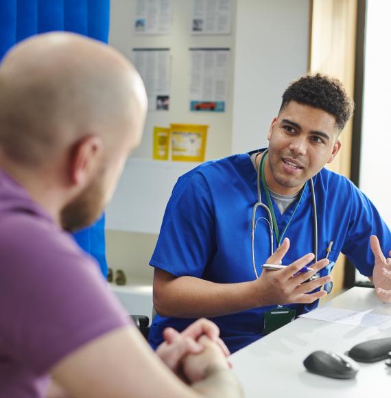 Doctor talking to male patient
