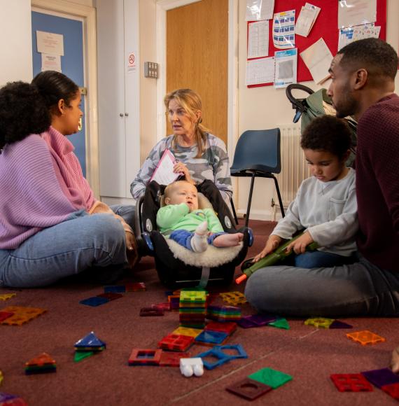 Family in a session with a childcare worker