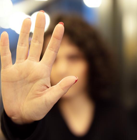Woman holding her hand up