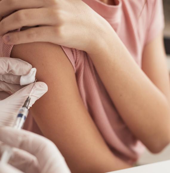 Young girl being vaccinated