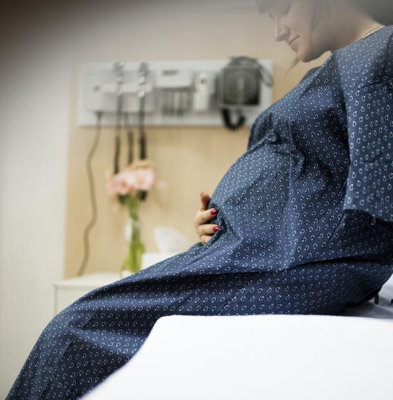 Pregnant woman on bed