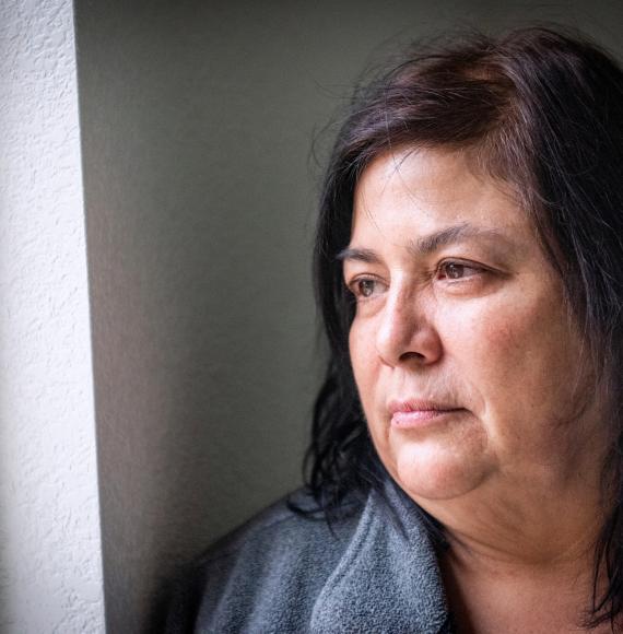 Woman looking out of window