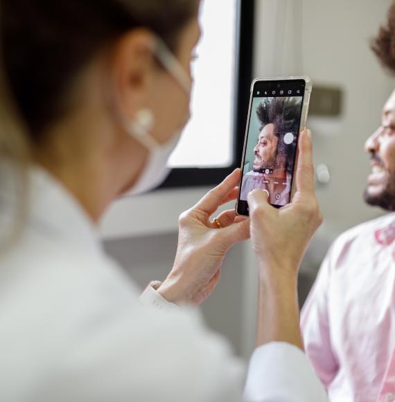 Doctor taking photo of an injury