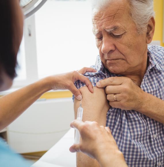 Older person being vaccinated