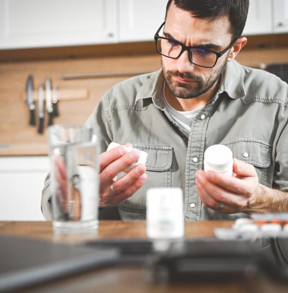 Man taking a pill