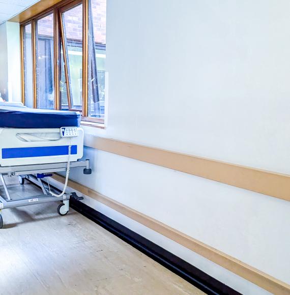 Bed in hospital corridor