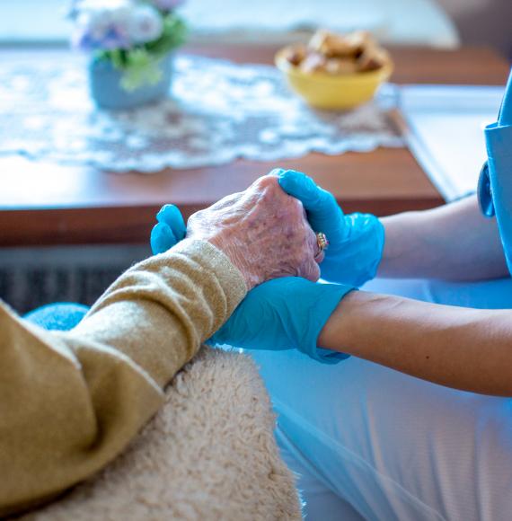 Social care worker with elderly patient