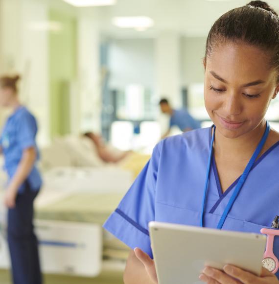 NHS nurse using iPad