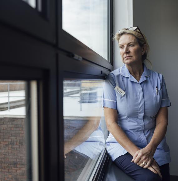 Nurse sat by a window