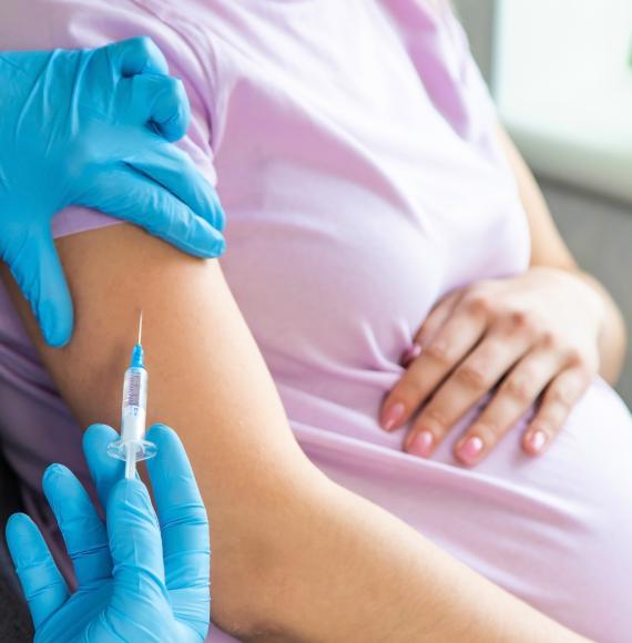 Pregnant woman being vaccinated