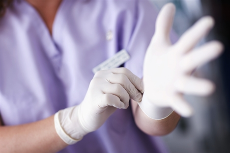 nurse wearing rubber gloves